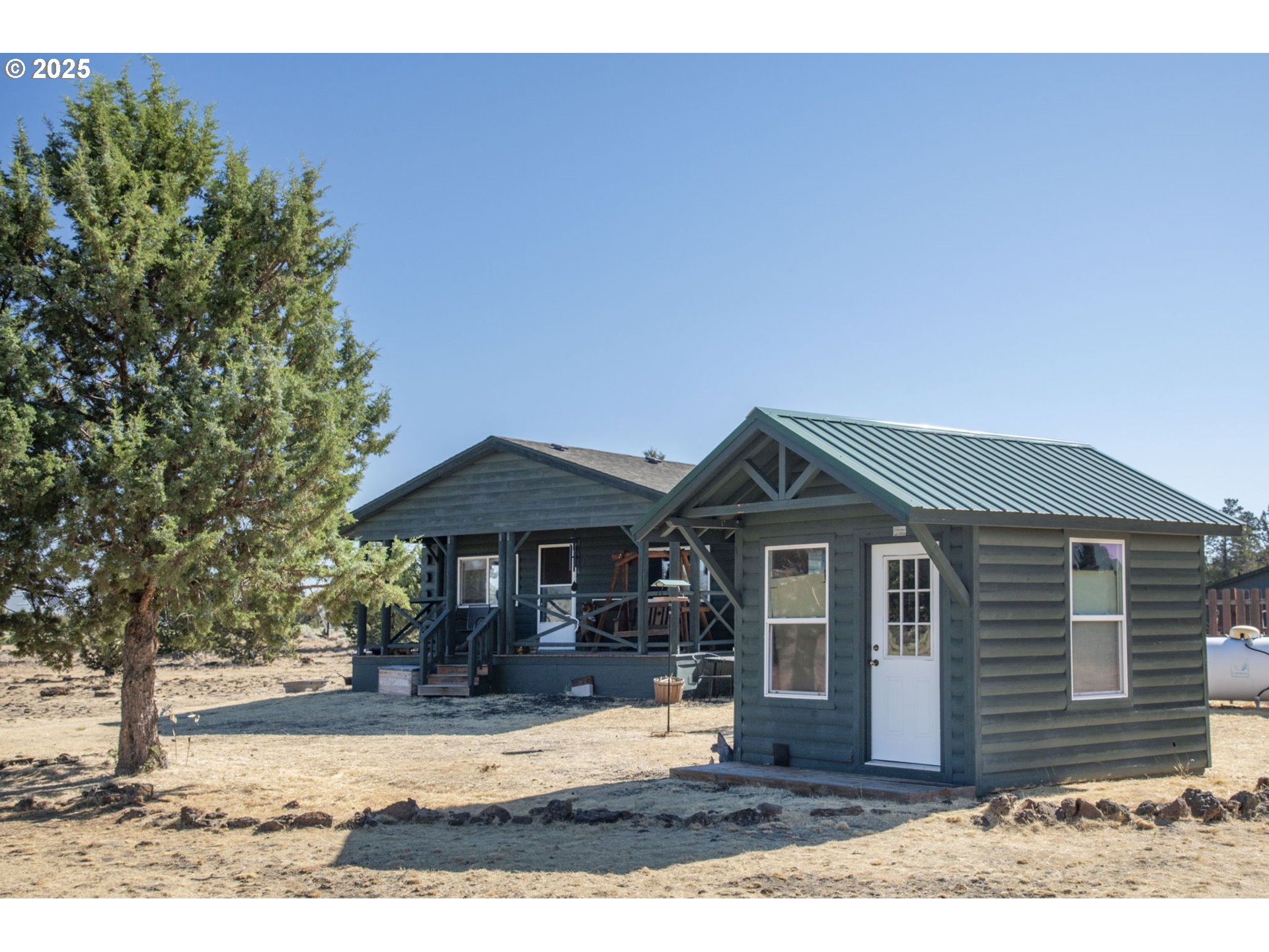 12510 Southwest Geneva Road Culver, OR 97734 - Photo 7 of 47 a front view of a house with garden