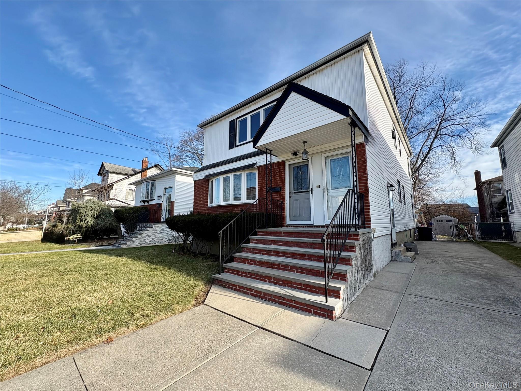 Undisclosed Address Valley Stream, NY 11581 - Photo 2 of 11 a view of a house with a back yard