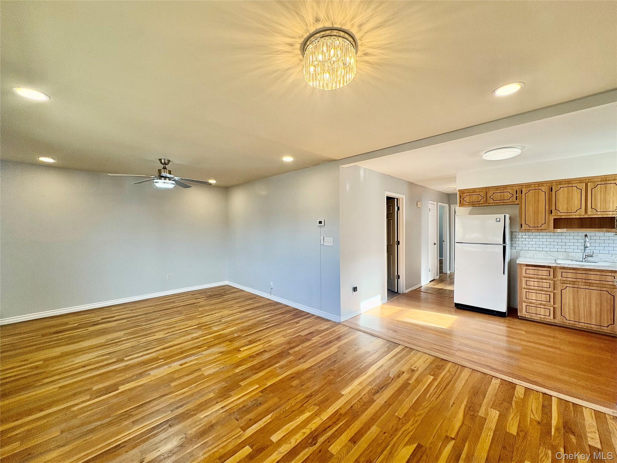 Undisclosed Address Valley Stream, NY 11581 - Photo 5 of 11 a view of a livingroom with a dishwasher and cabinets
