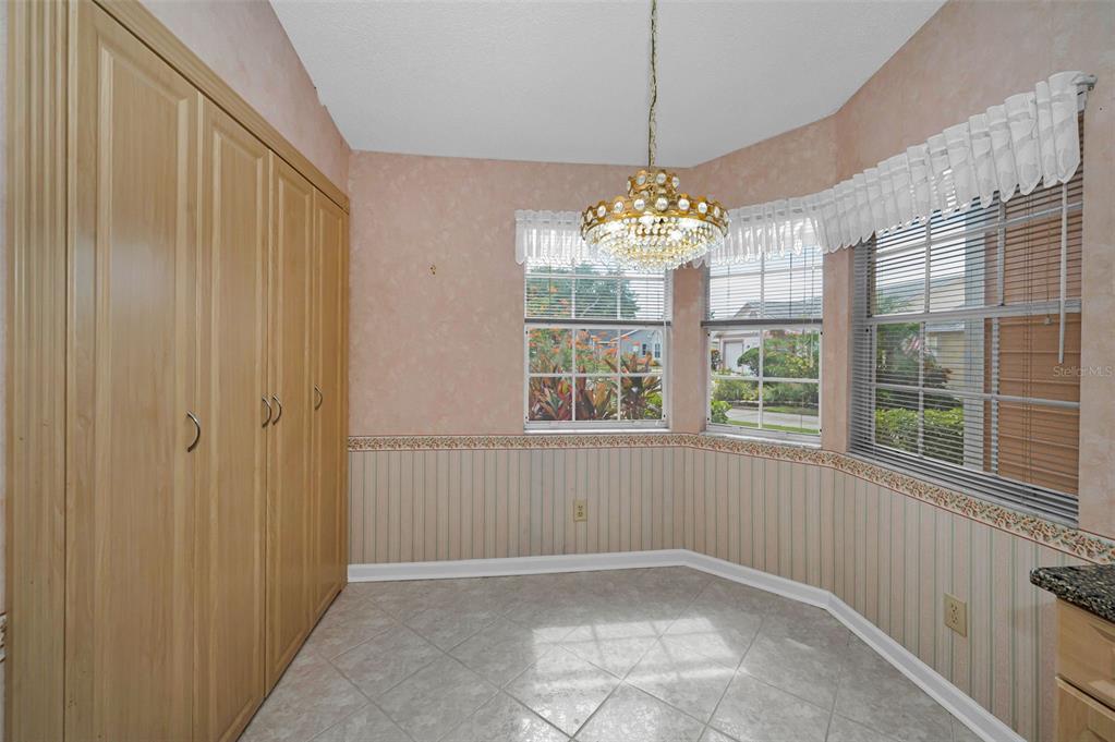 1481 Cairn Court Palm Harbor, FL 34683 - Photo 17 of 40 wooden floor in an empty room with a window