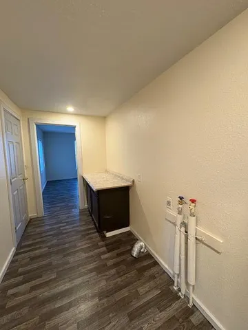 a view of a livingroom with wooden floor