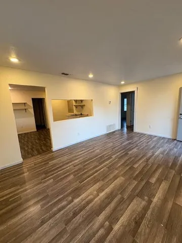 a view of a livingroom with wooden floor