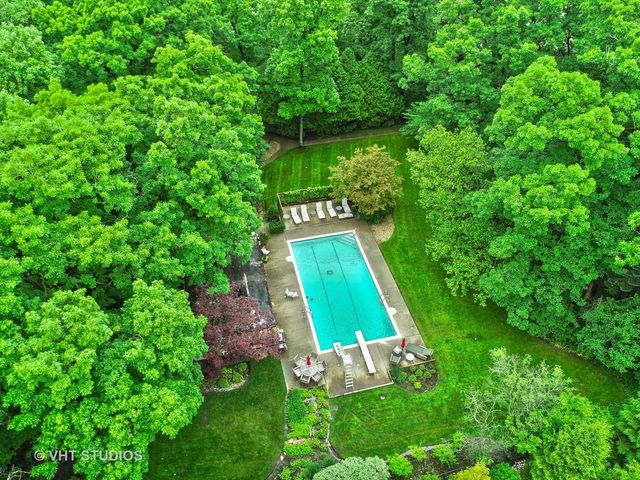 swimming pool view with a seating space and deck