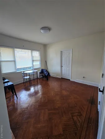 a view of a livingroom with wooden floor