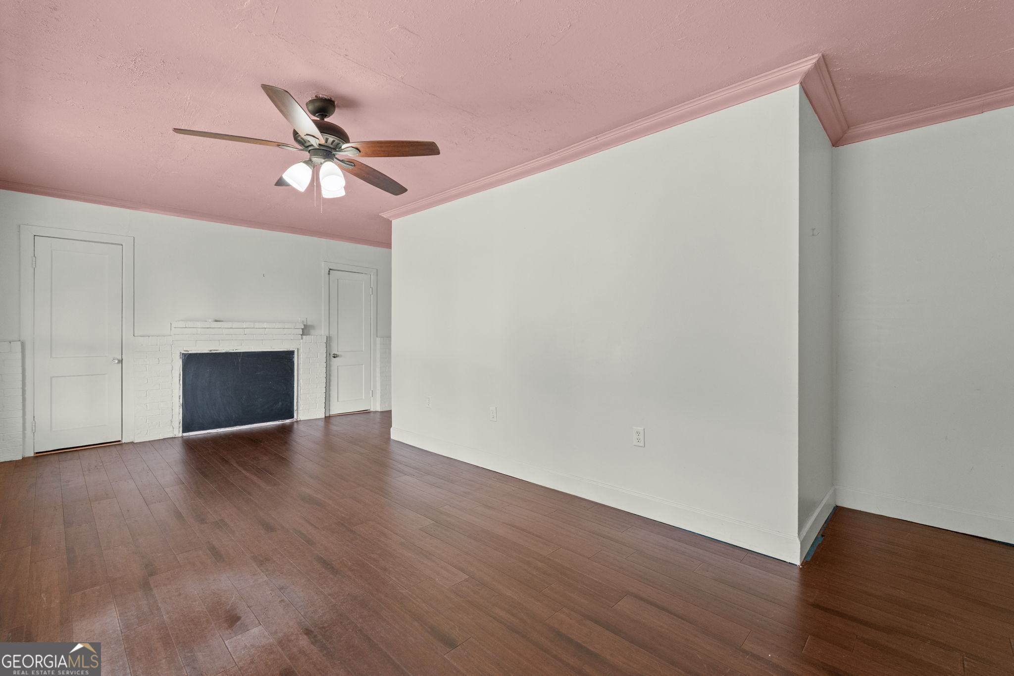 49 Frost Road Bowdon, GA 30108 - Photo 28 of 60 a view of empty room with wooden floor and fireplace