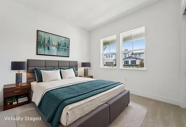 a bedroom with bed and wall painting with wooden floor