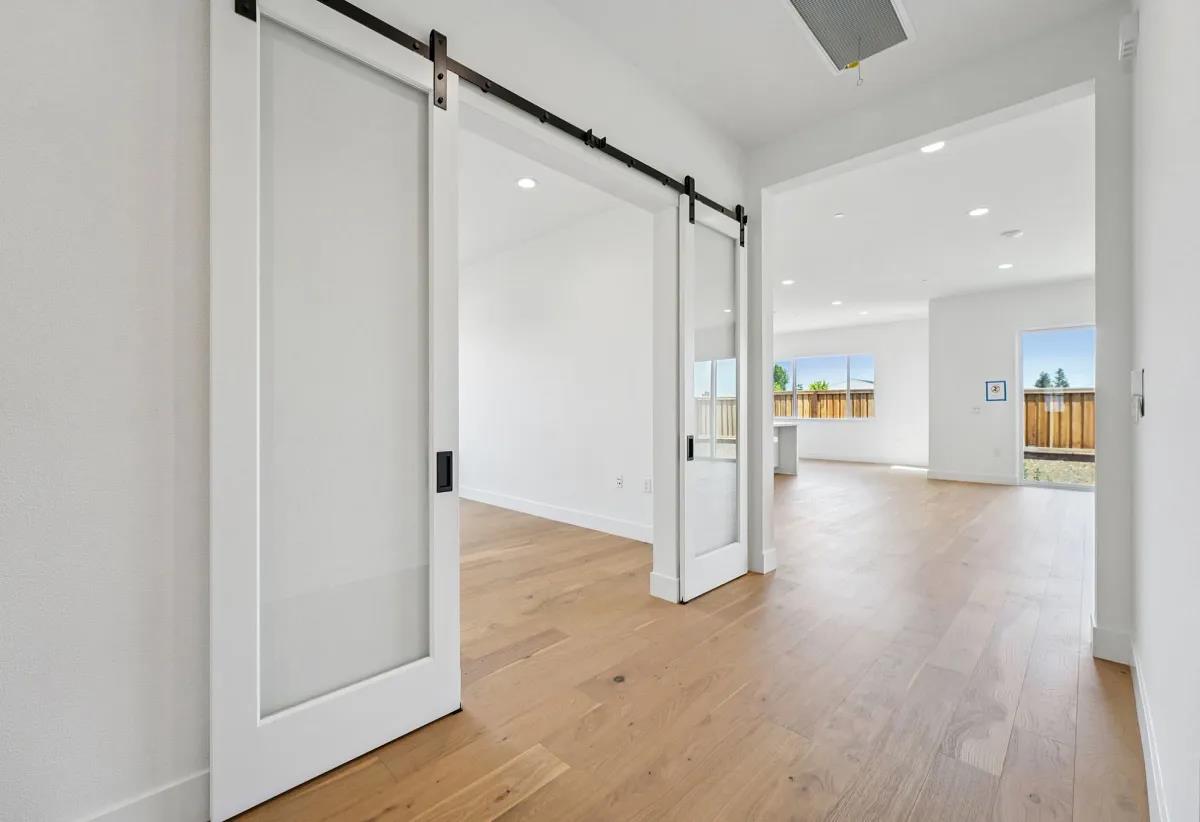 475 Trellis Way Brentwood, CA 94513 - Photo 14 of 16 a view of a hallway with wooden floor