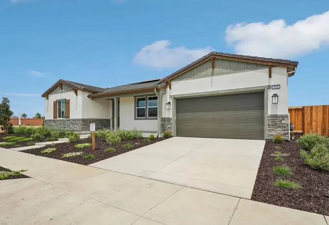 a front view of a house with yard