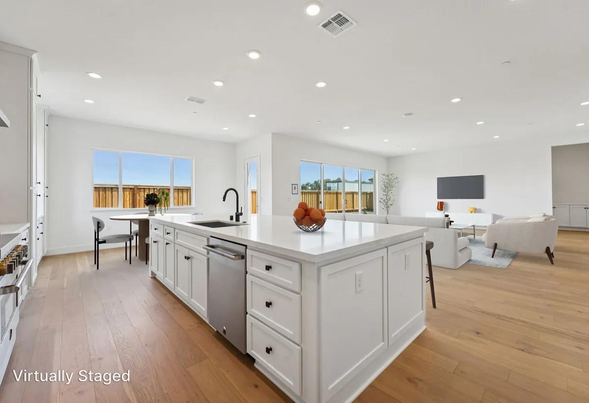 475 Trellis Way Brentwood, CA 94513 - Photo 6 of 16 a kitchen with stainless steel appliances granite countertop a lot of counter top space and cabinets