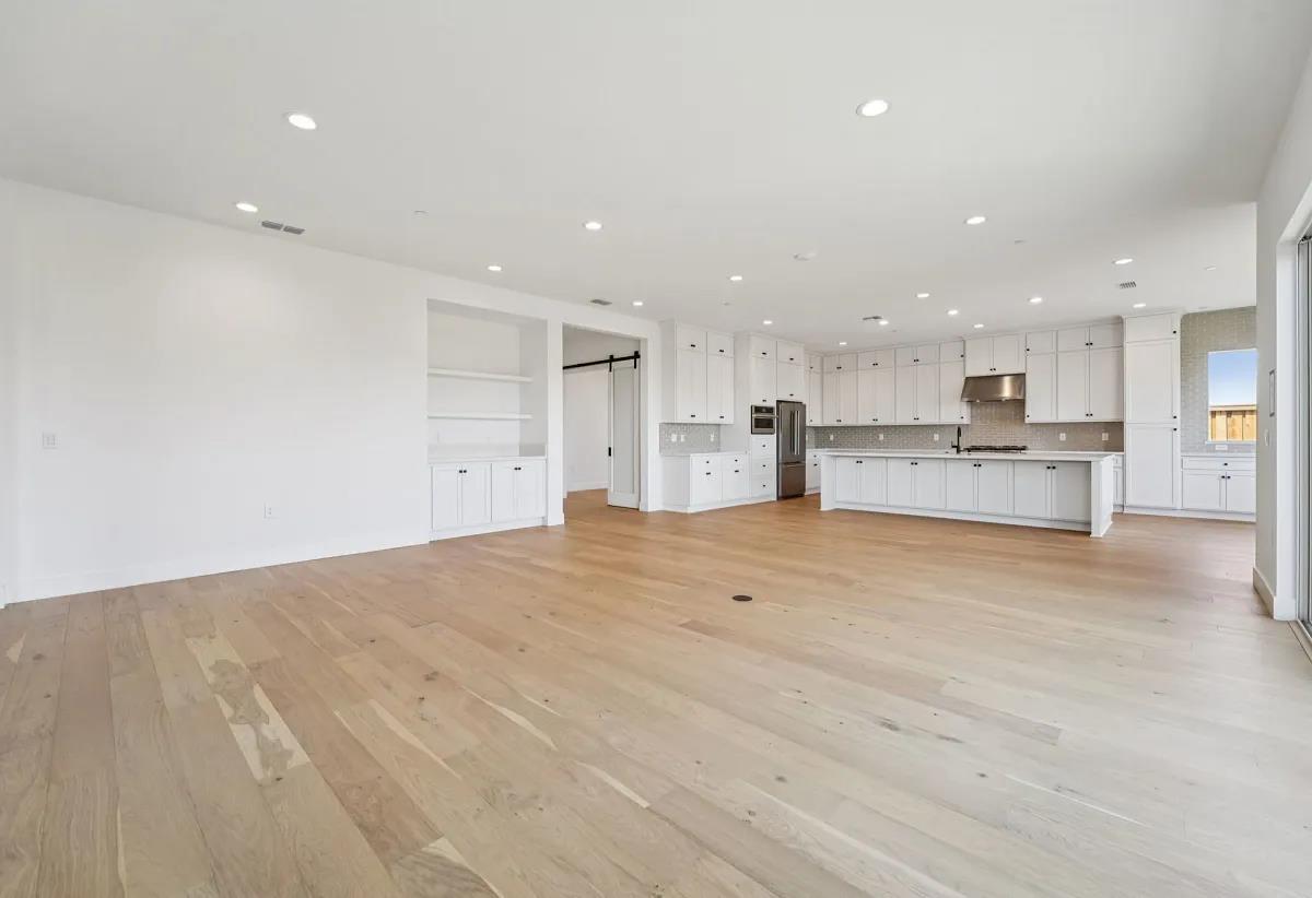 475 Trellis Way Brentwood, CA 94513 - Photo 8 of 16 a view of kitchen with refrigerator stove and a view of living room