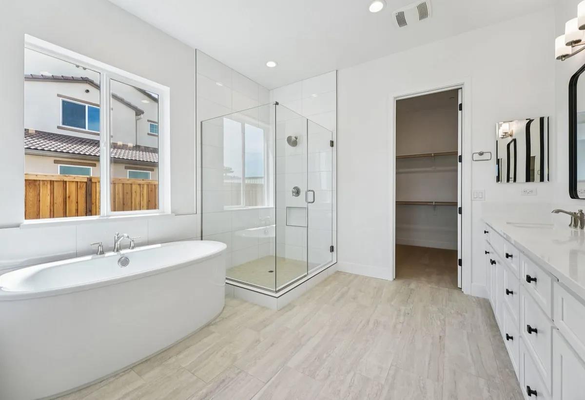 475 Trellis Way Brentwood, CA 94513 - Photo 10 of 16 a bathroom with a tub sink shower and mirror