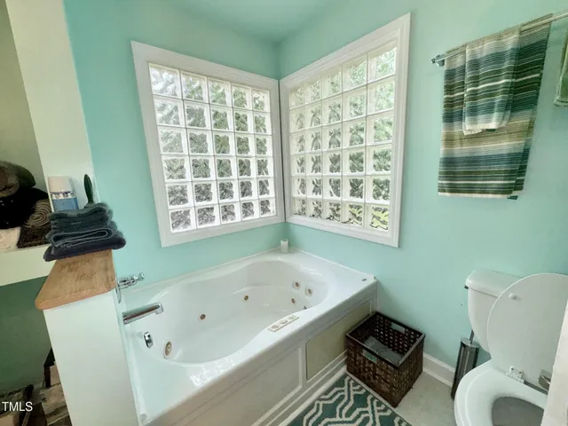 a bathroom with a bathtub sink and toilet