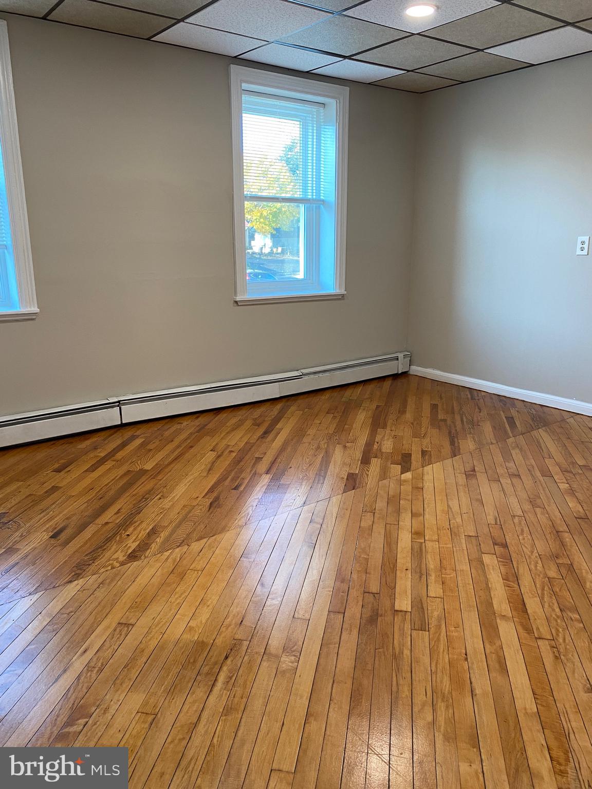 327 South Church Street, Unit 1 Spring City, PA 19475 - Photo 23 of 36 a view of a room with wooden floor and white walls