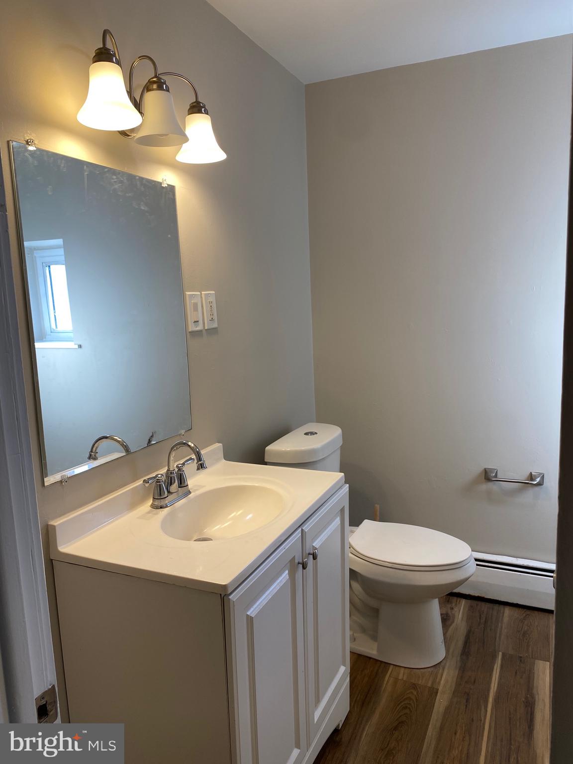 327 South Church Street, Unit 1 Spring City, PA 19475 - Photo 27 of 36 a bathroom with a sink mirror and toilet