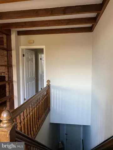 a view of a porch with wooden floor