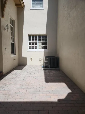 a kitchen with stainless steel appliances granite countertop a sink counter space cabinets and a refrigerator