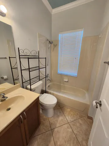 a view of an empty room with windows