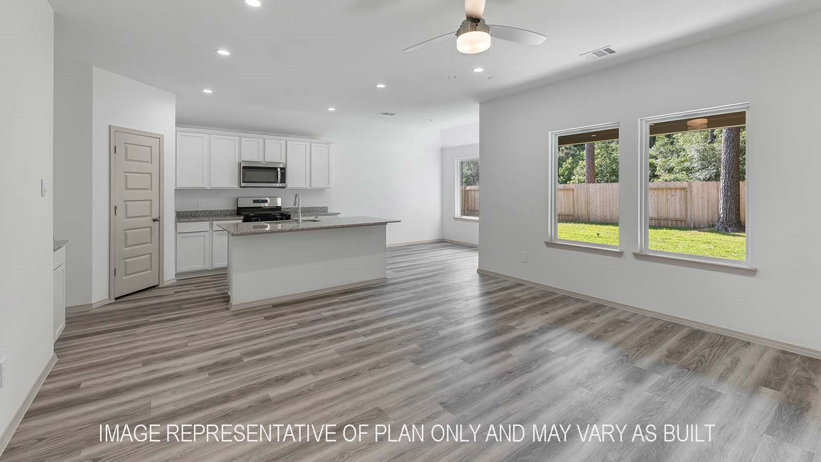 5695 Spoonbill Lane Orange, TX 77632 - Photo 10 of 22 a kitchen with stainless steel appliances granite countertop a stove a sink and a refrigerator