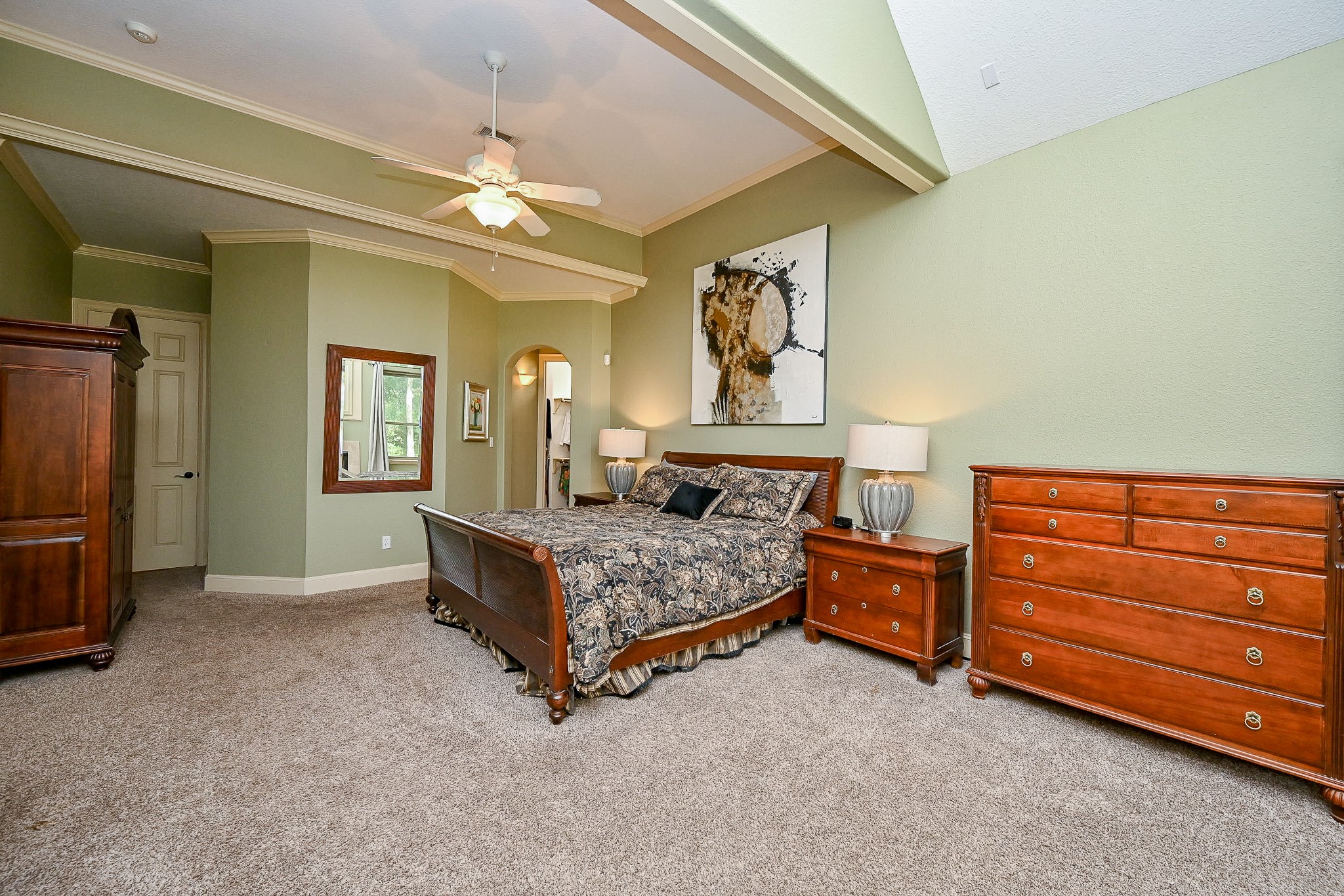 23914 Clouds Rest Magnolia, TX 77355 - Photo 24 of 50 a bedroom with a bed and a chandelier