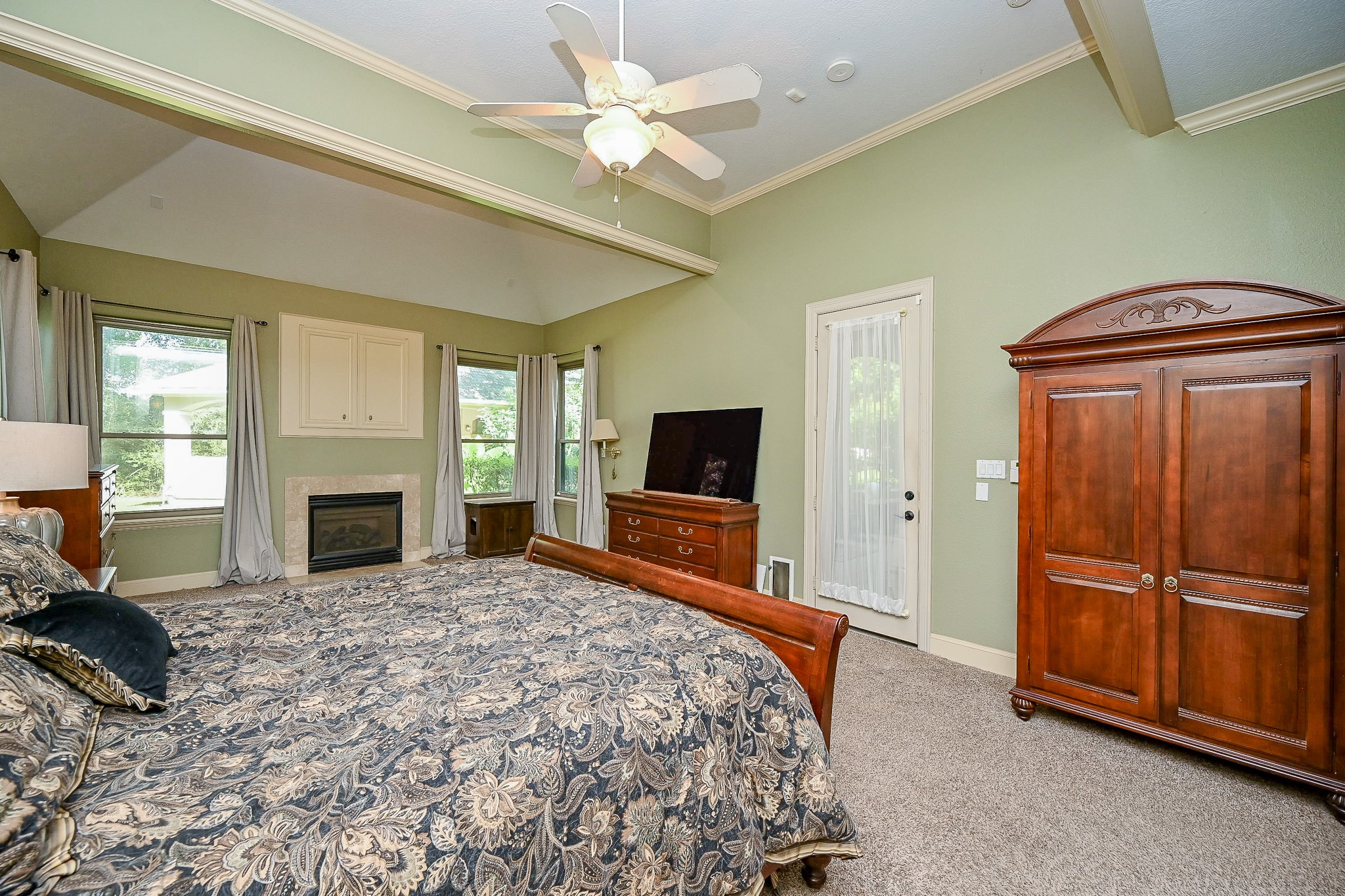 23914 Clouds Rest Magnolia, TX 77355 - Photo 25 of 50 a bedroom with a bed and a fireplace