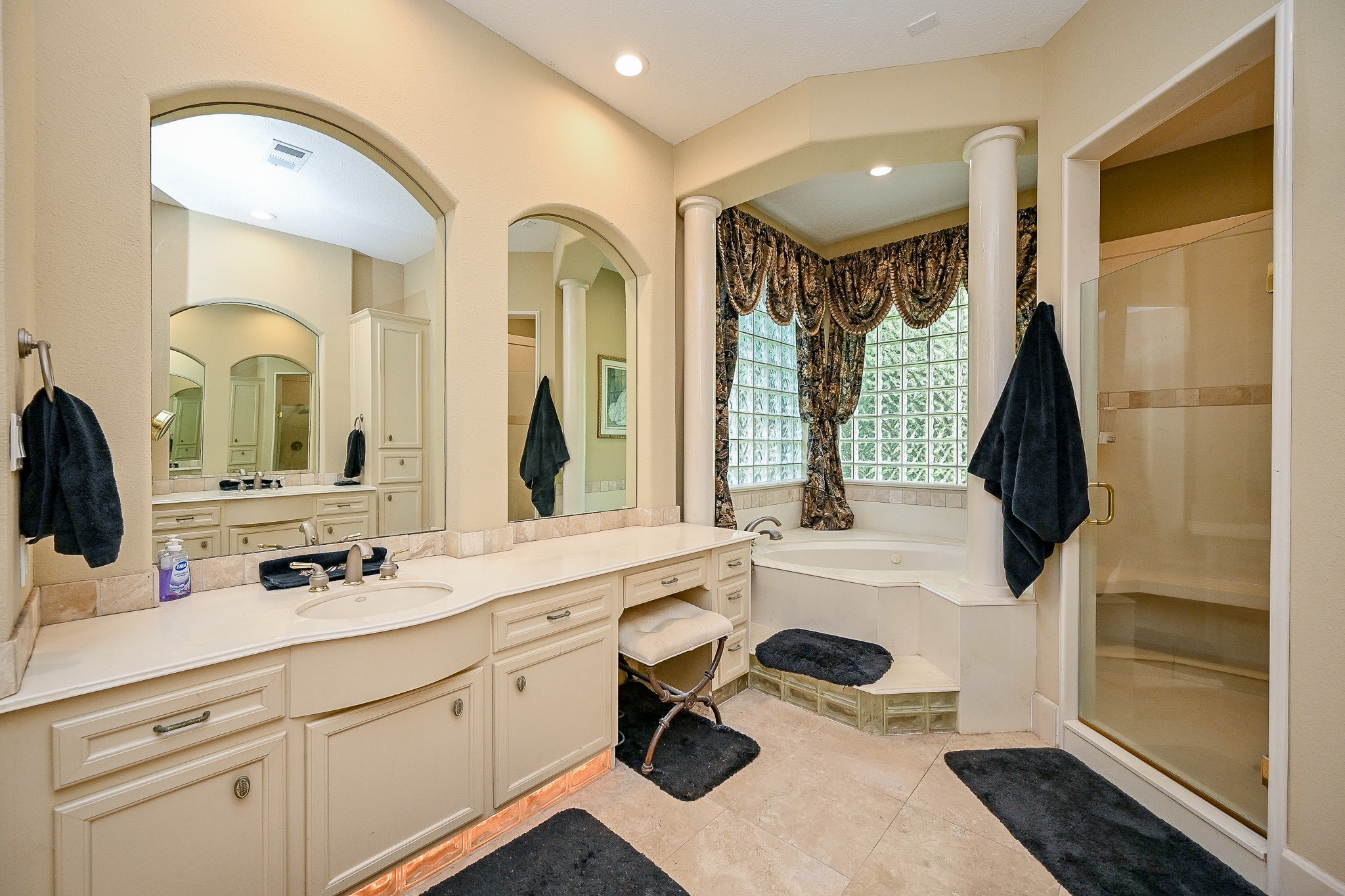 23914 Clouds Rest Magnolia, TX 77355 - Photo 26 of 50 a bathroom with a sink a large mirror and a bathtub next to a window