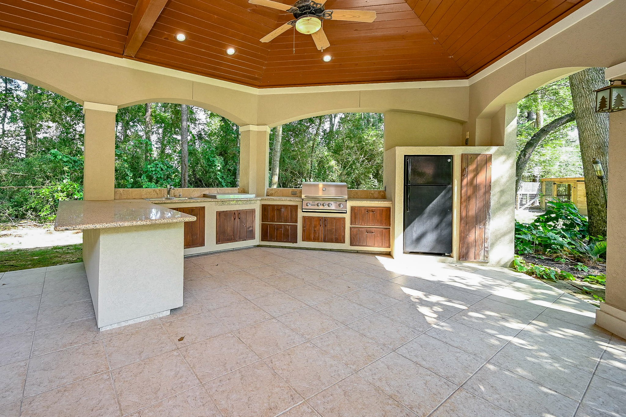 23914 Clouds Rest Magnolia, TX 77355 - Photo 3 of 50 a view of a porch with furniture and garden