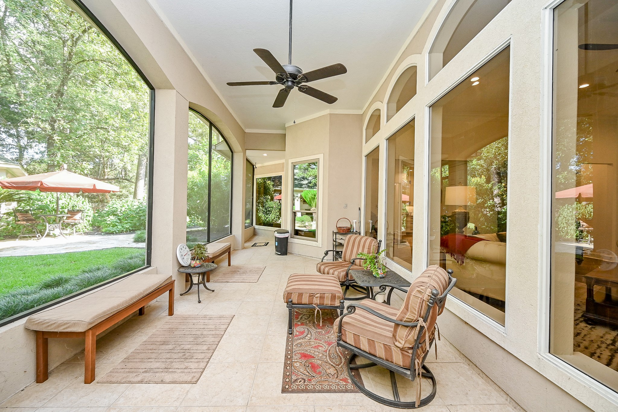 23914 Clouds Rest Magnolia, TX 77355 - Photo 33 of 50 a living room with patio furniture and a floor to ceiling window