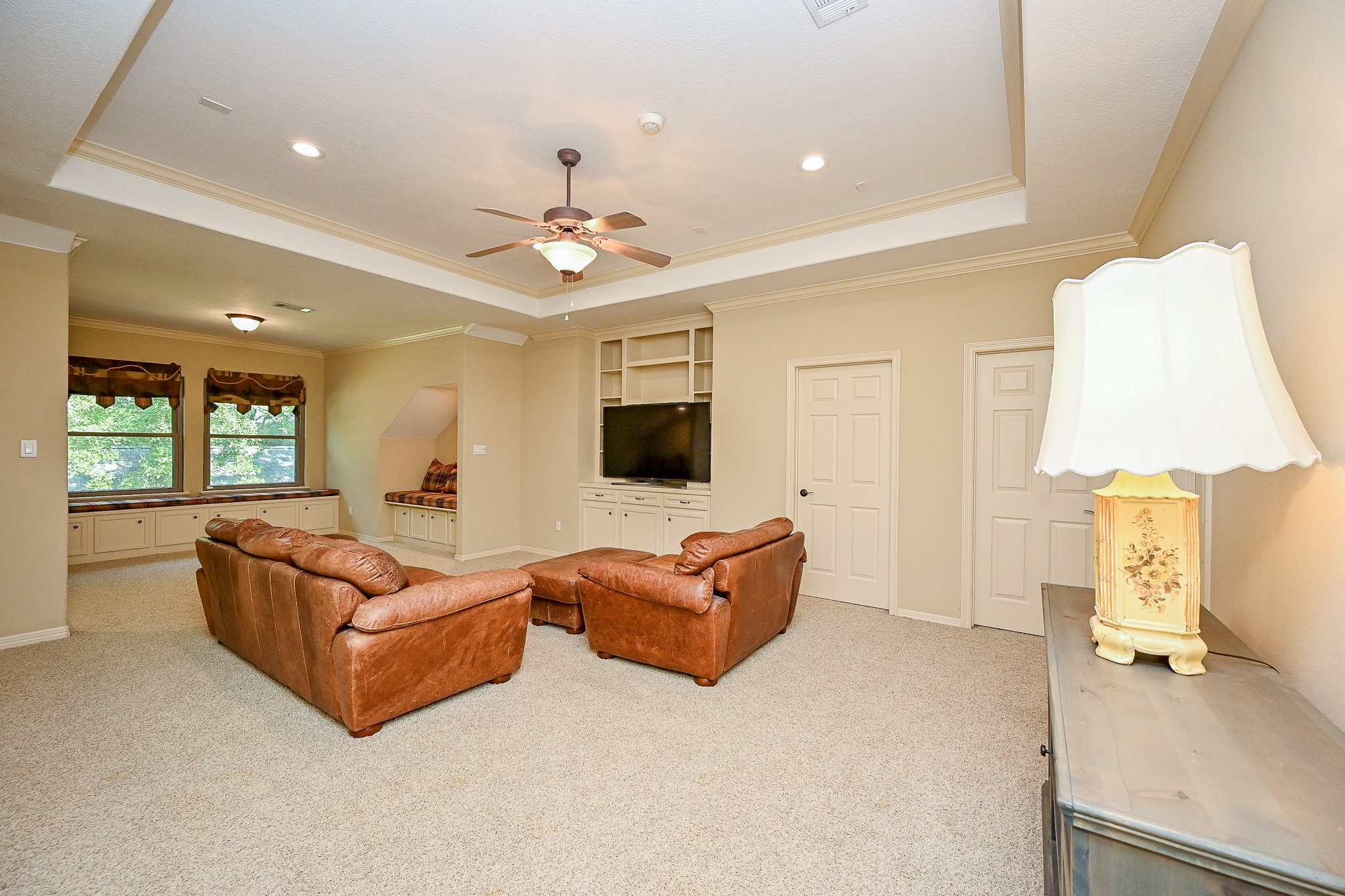 23914 Clouds Rest Magnolia, TX 77355 - Photo 39 of 50 a living room with furniture and a flat screen tv