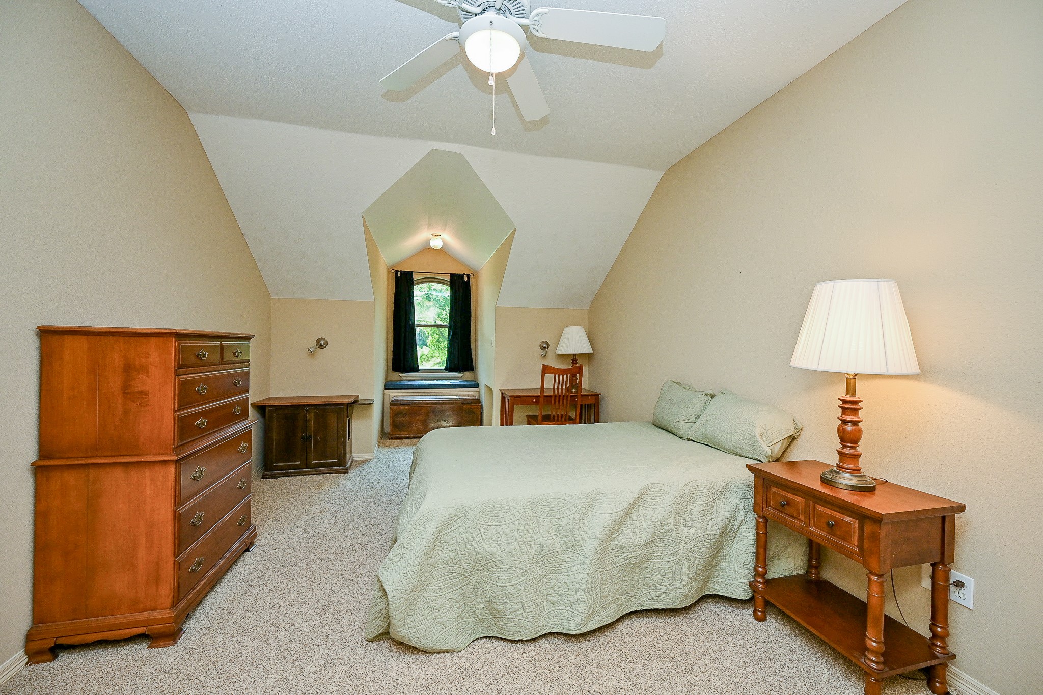 23914 Clouds Rest Magnolia, TX 77355 - Photo 45 of 50 a spacious bedroom with a bed a dresser and potted plants on the table