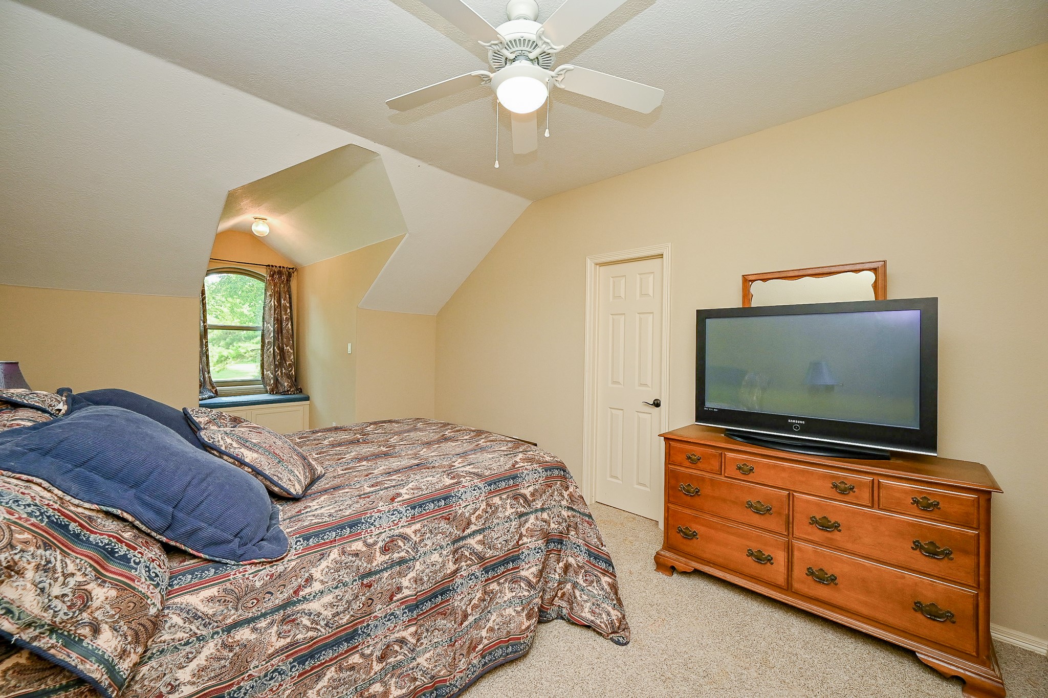 23914 Clouds Rest Magnolia, TX 77355 - Photo 49 of 50 a bedroom with a bed and a flat screen tv