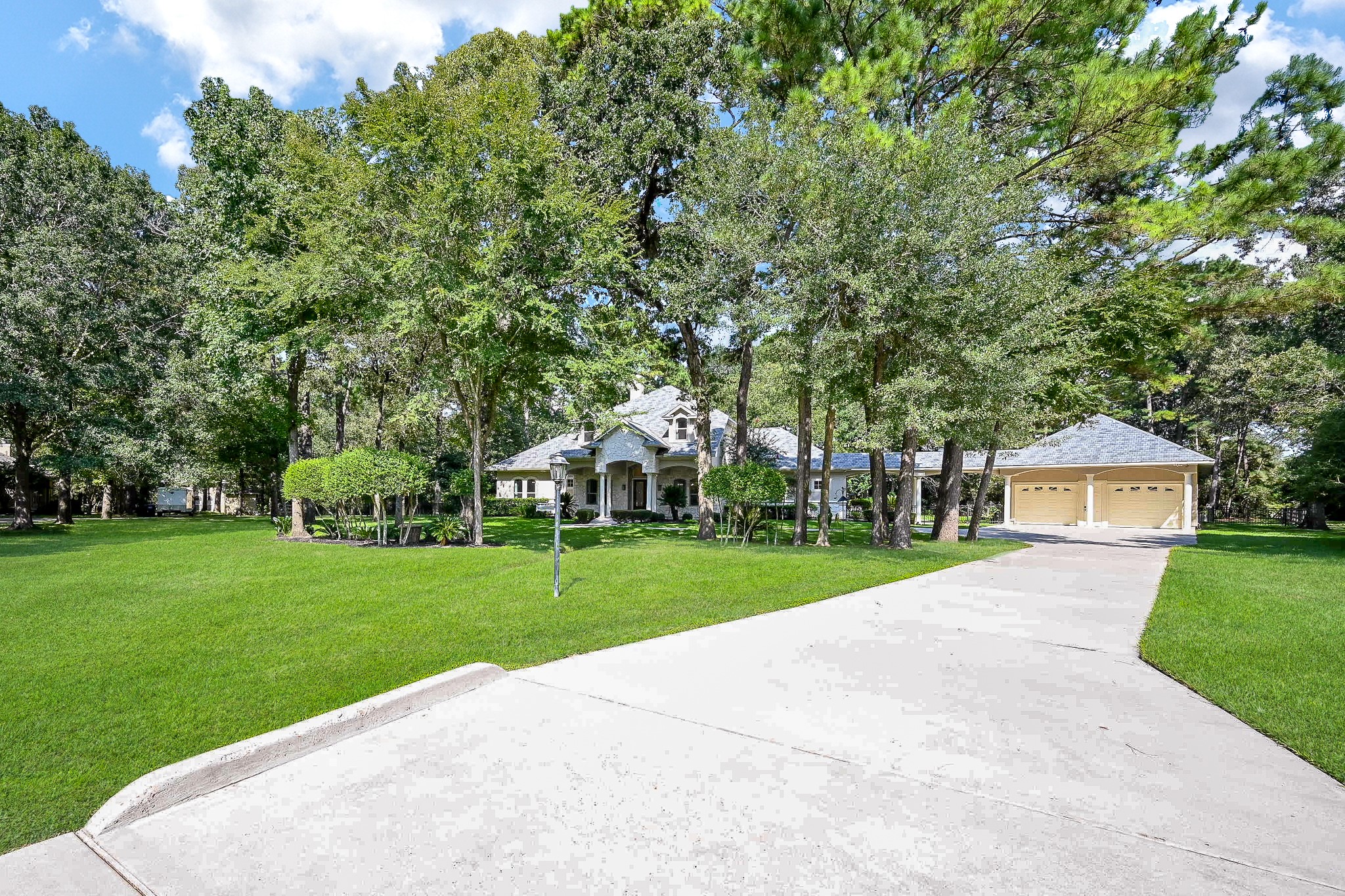 23914 Clouds Rest Magnolia, TX 77355 - Photo 50 of 50 a front view of a house with a yard and trees