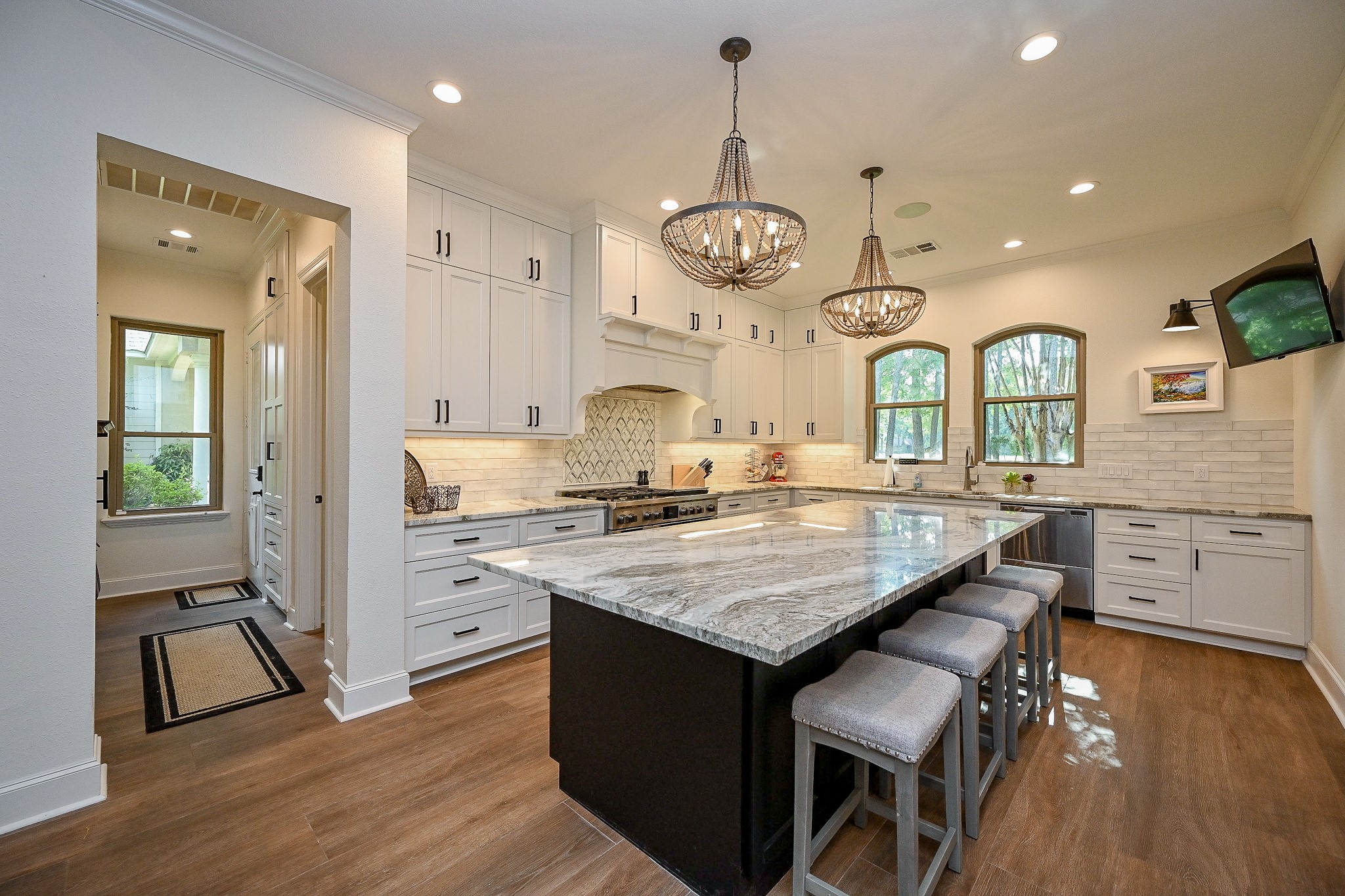 23914 Clouds Rest Magnolia, TX 77355 - Photo 7 of 50 a kitchen with stainless steel appliances granite countertop wooden floors and view of living room