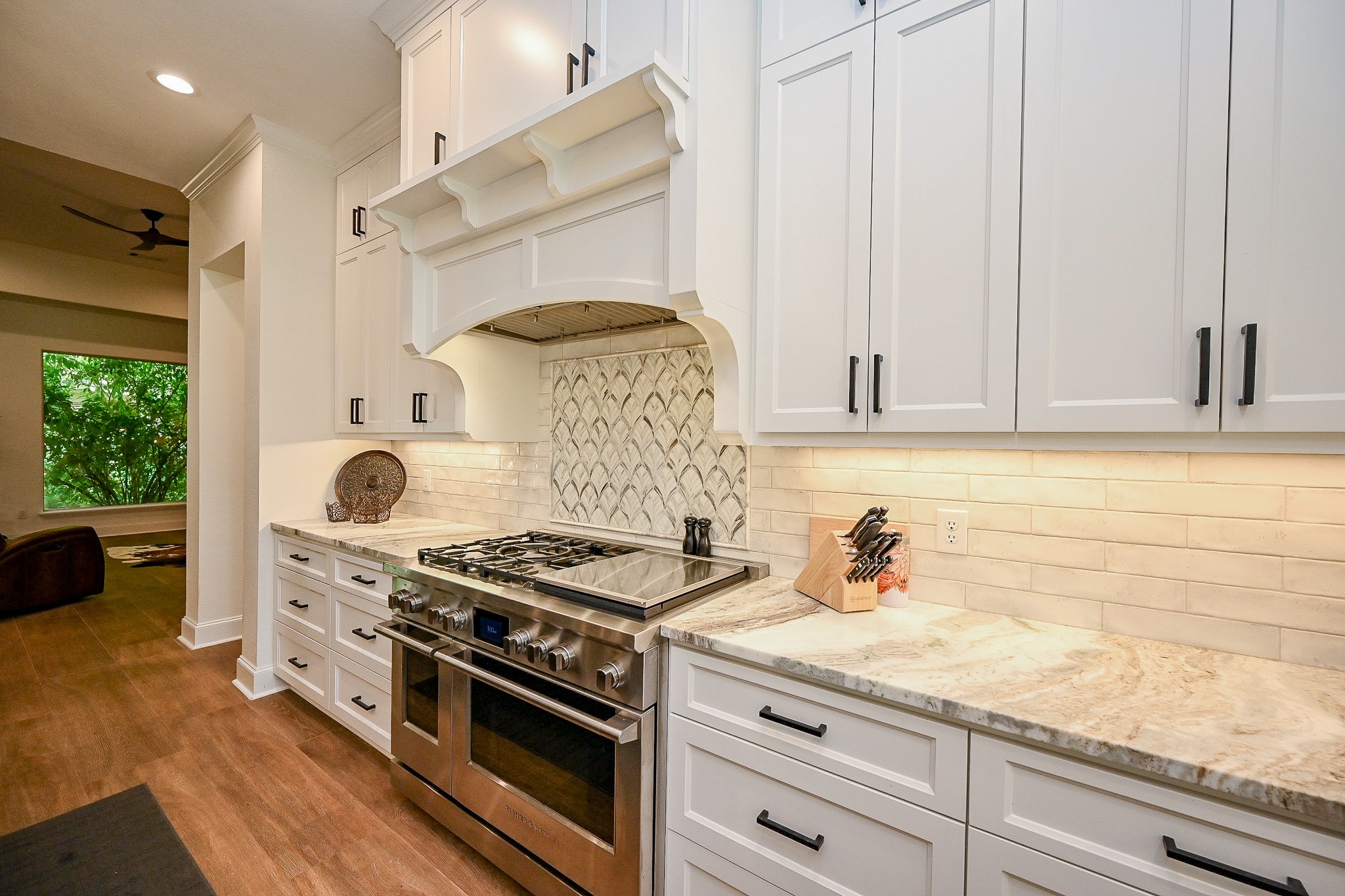 23914 Clouds Rest Magnolia, TX 77355 - Photo 9 of 50 a kitchen with stainless steel appliances granite countertop a stove and a sink