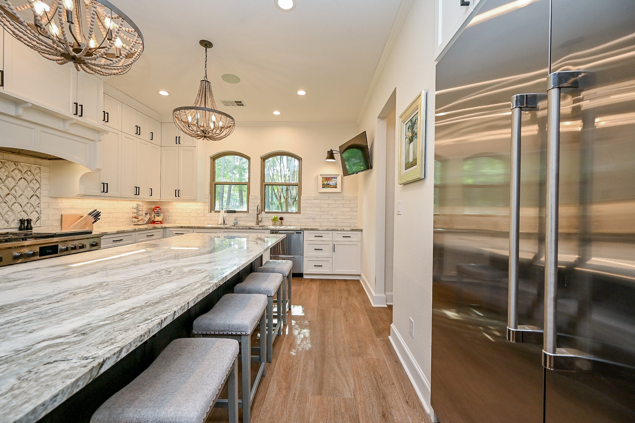 23914 Clouds Rest Magnolia, TX 77355 - Photo 10 of 50 a large kitchen with a large window a counter space a sink and stainless steel appliances