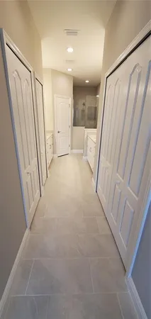 a view of a hallway with a large window