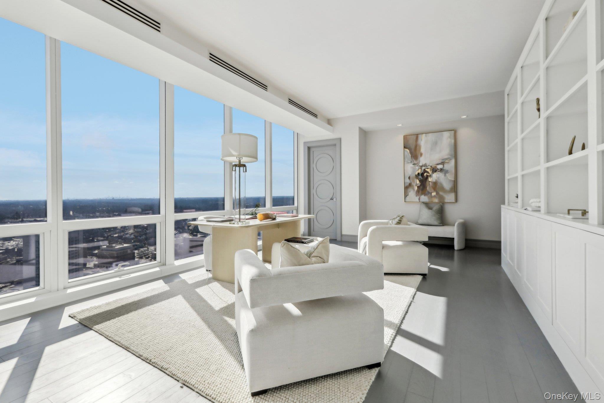 5 Renaissance Square, Unit PH41G White Plains, NY 10601 - Photo 13 of 26 a living room with furniture and a table