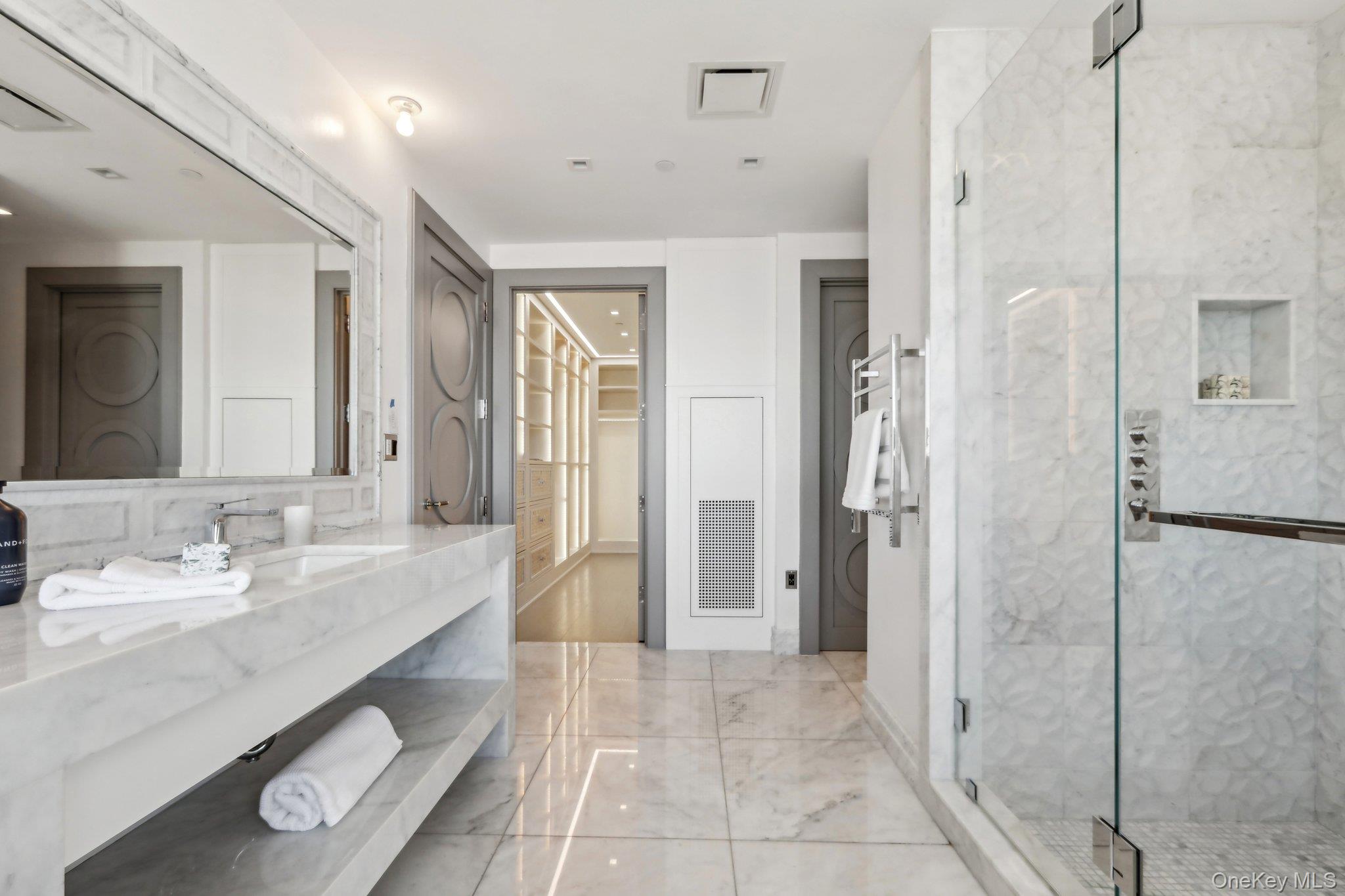 5 Renaissance Square, Unit PH41G White Plains, NY 10601 - Photo 15 of 26 a bathroom with a sink a toilet and shower