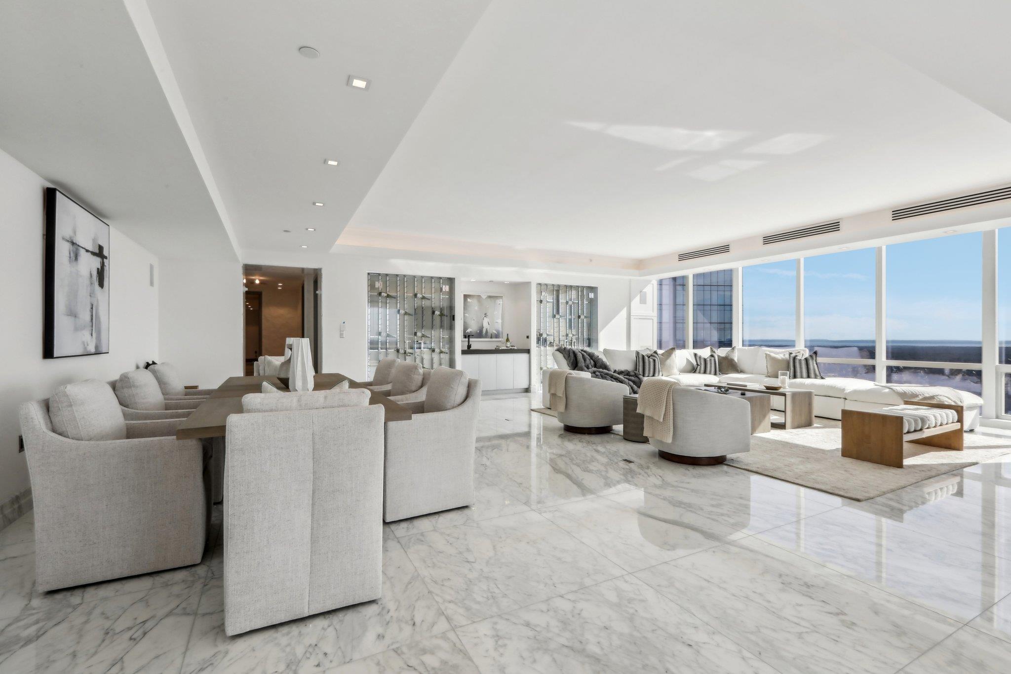 5 Renaissance Square, Unit PH41G White Plains, NY 10601 - Photo 4 of 26 a living room with furniture and a large window