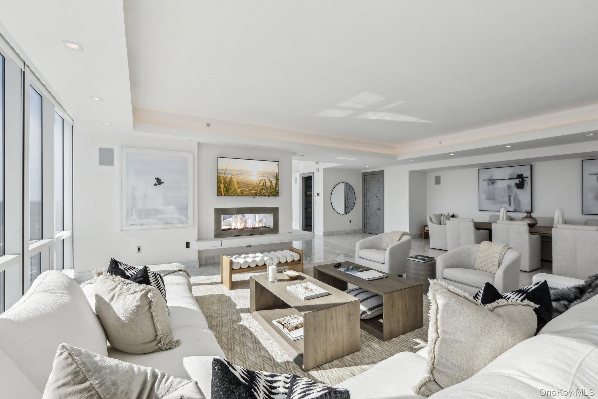 5 Renaissance Square, Unit PH41G White Plains, NY 10601 - Photo 5 of 26 a living room with furniture or couch and a window