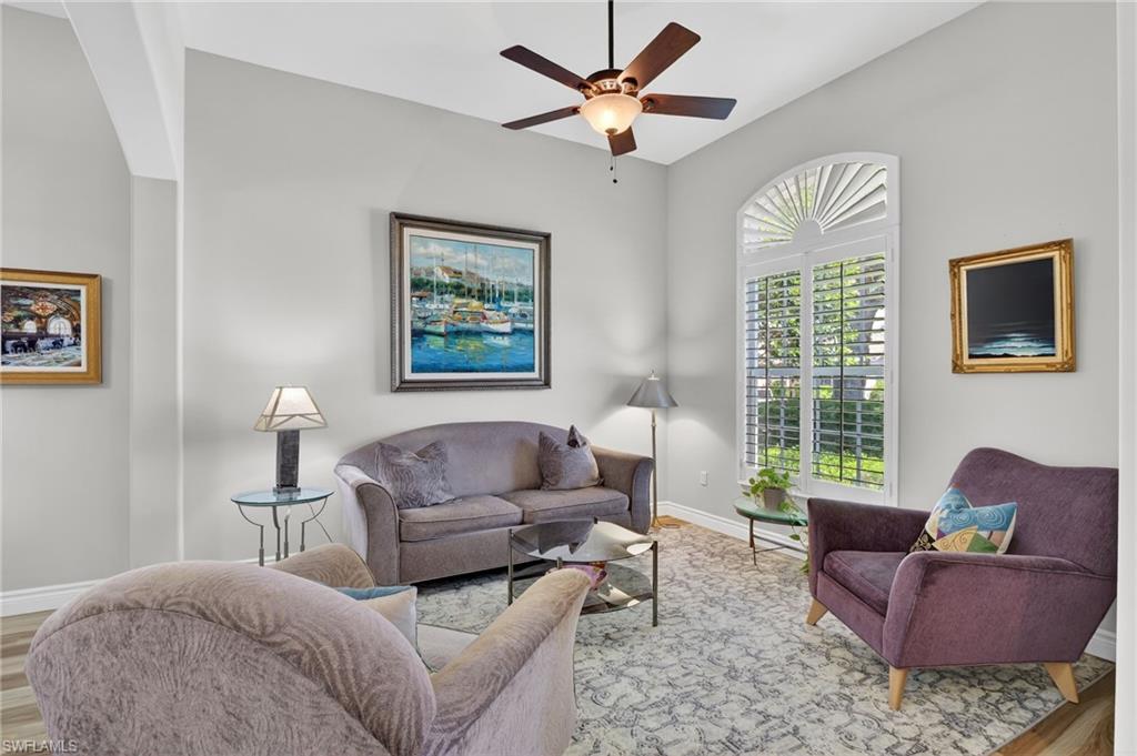 2065 Mandarin Lane Naples, FL 34120 - Photo 14 of 46 a living room with furniture and a window