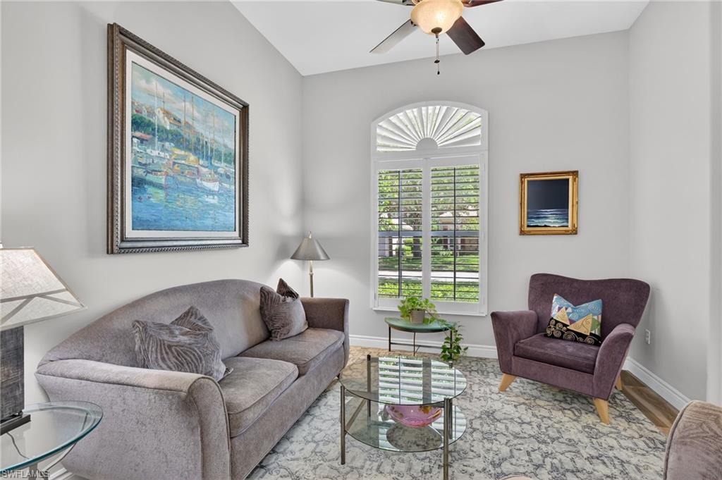 2065 Mandarin Lane Naples, FL 34120 - Photo 15 of 46 a living room with furniture and a window