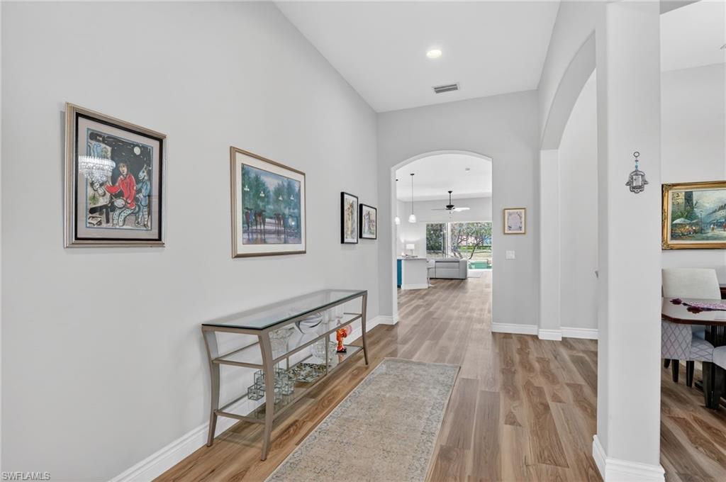 2065 Mandarin Lane Naples, FL 34120 - Photo 16 of 46 a view of a hallway with a living room