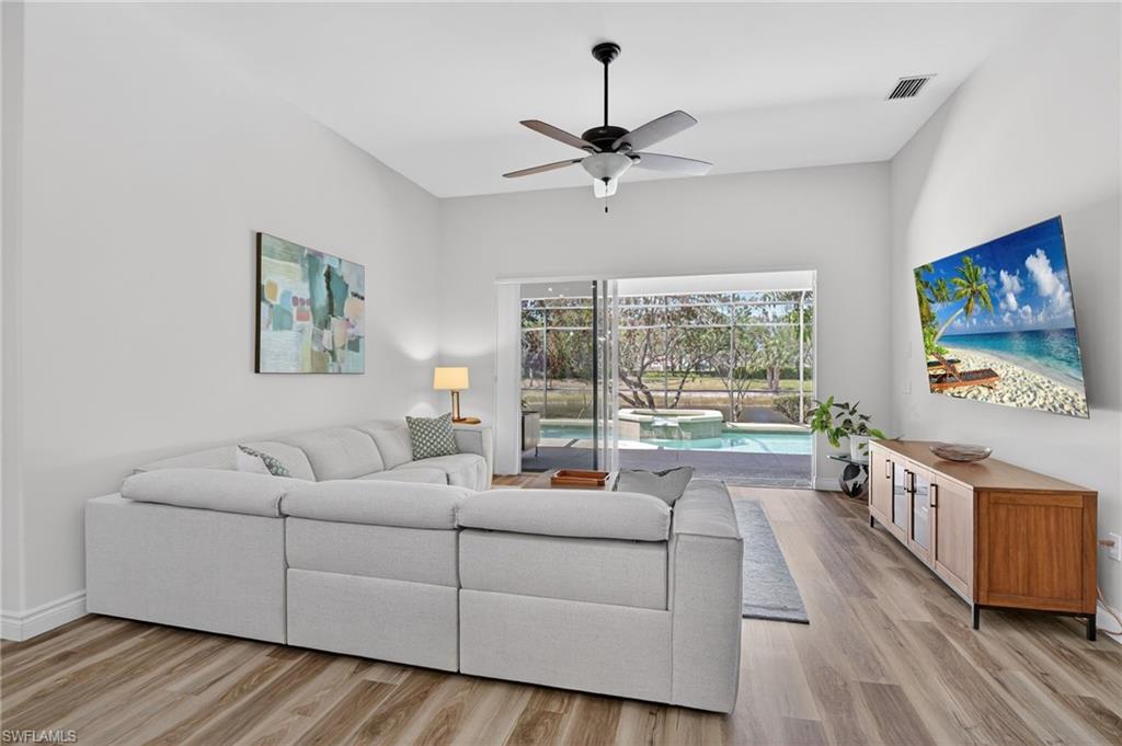 2065 Mandarin Lane Naples, FL 34120 - Photo 25 of 46 a living room with furniture and a large window
