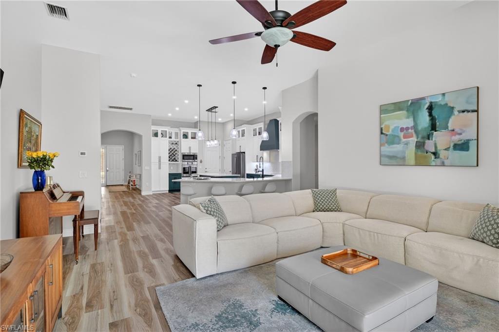2065 Mandarin Lane Naples, FL 34120 - Photo 26 of 46 a living room with furniture and a large window