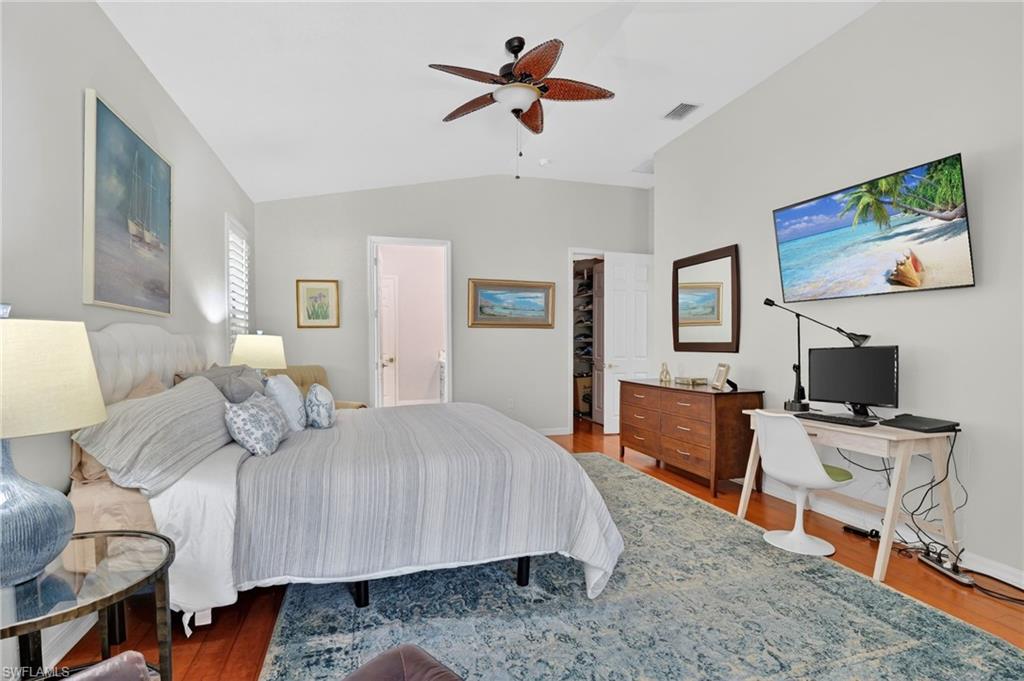 2065 Mandarin Lane Naples, FL 34120 - Photo 33 of 46 a bedroom with a bed and a flat screen tv