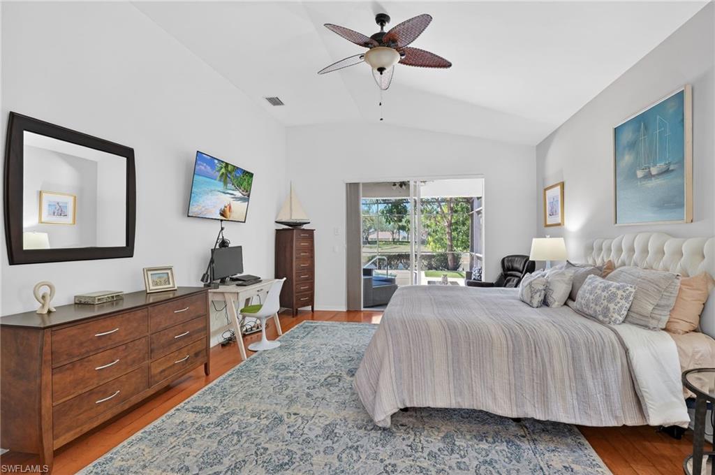 2065 Mandarin Lane Naples, FL 34120 - Photo 34 of 46 a bedroom with a bed and a dresser