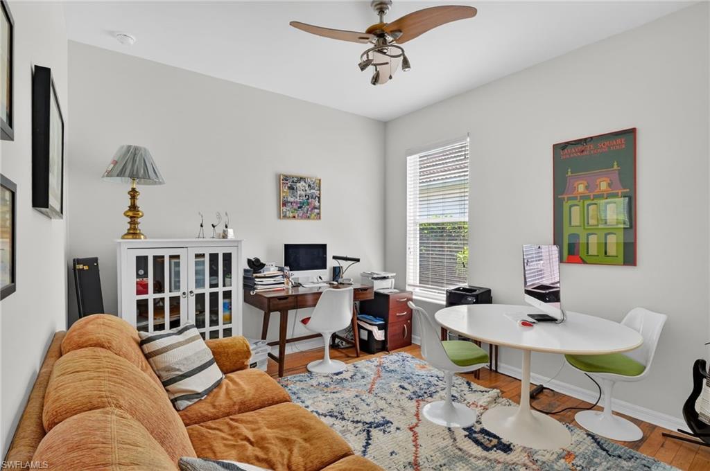 2065 Mandarin Lane Naples, FL 34120 - Photo 36 of 46 a living room with furniture fireplace and a window