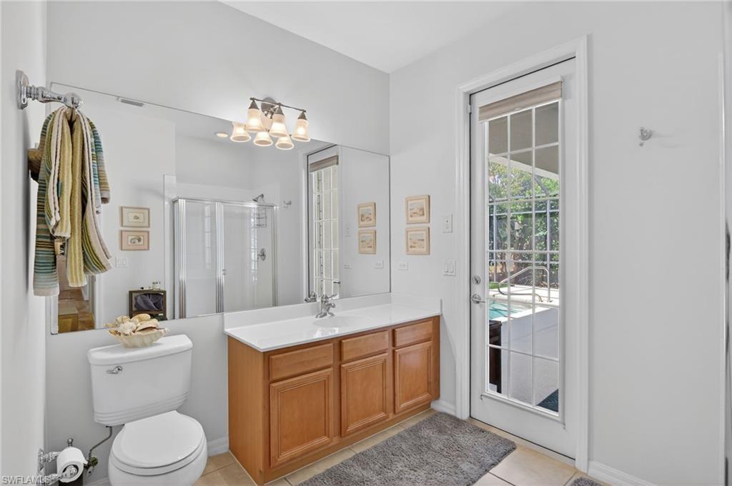 2065 Mandarin Lane Naples, FL 34120 - Photo 44 of 46 a bathroom with a double vanity sink toilet and shower