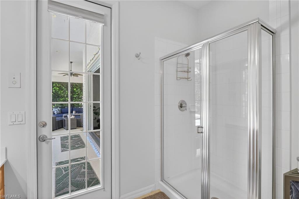 2065 Mandarin Lane Naples, FL 34120 - Photo 45 of 46 a bathroom with a glass shower door
