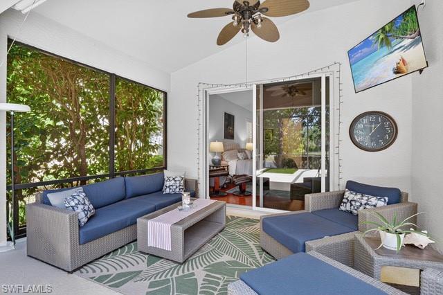 2065 Mandarin Lane Naples, FL 34120 - Photo 6 of 46 a living room with furniture and a large window